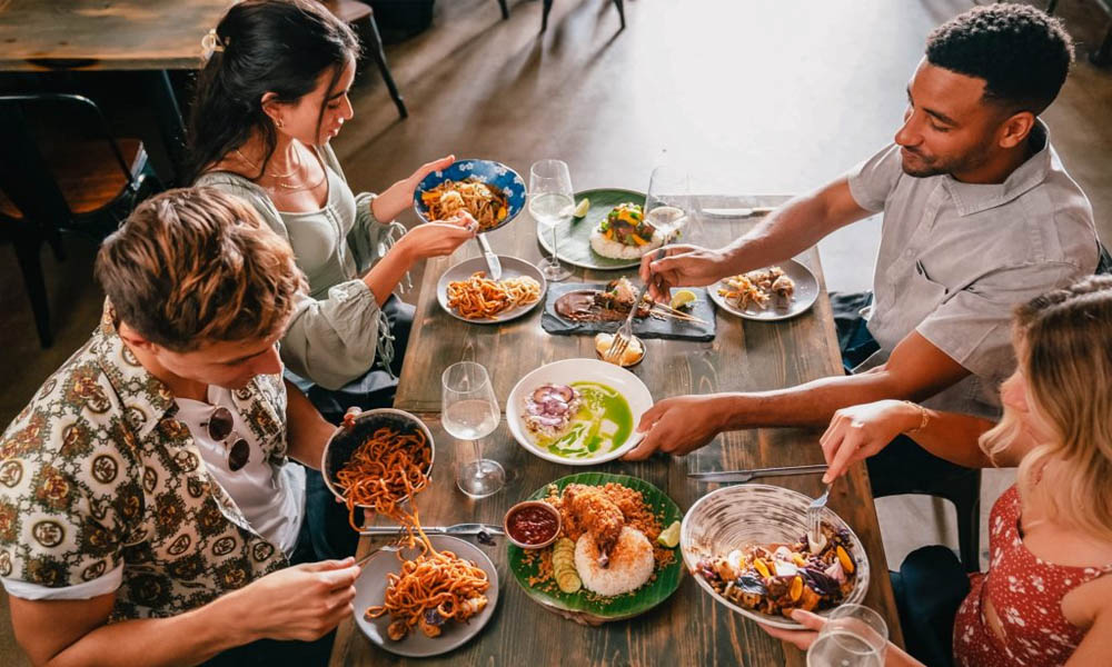 A group of people eating at Dija Mara restaurant in Oceanside CA.